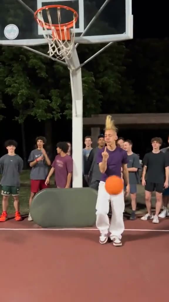 A player flipping the finger at the camera after the dunk, from a viral Middle Finger Dunk video